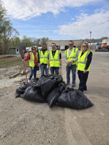 Volunteers proudly displaying the results of their cleanup efforts.