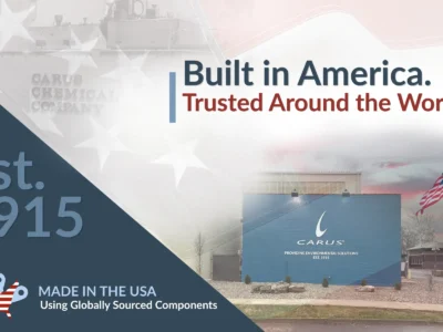 Promotional image for Carus Chemical Company featuring the text "Built in America. Trusted Around the World.", "Est. 1915", and "Made in the USA Using Globally Sourced Components", with a photo of the company building and an American flag.