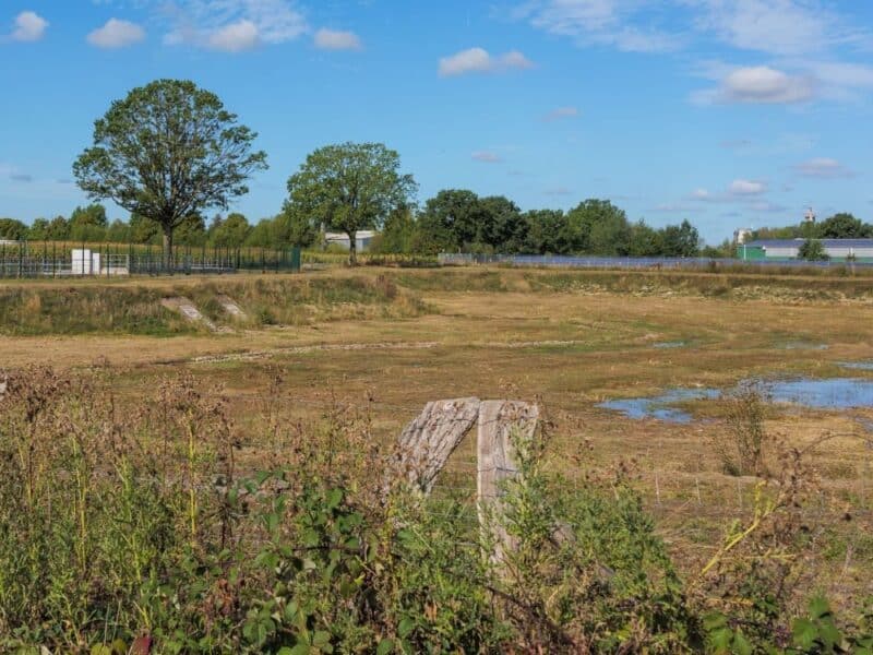 A surface water detention basin holding standing water.