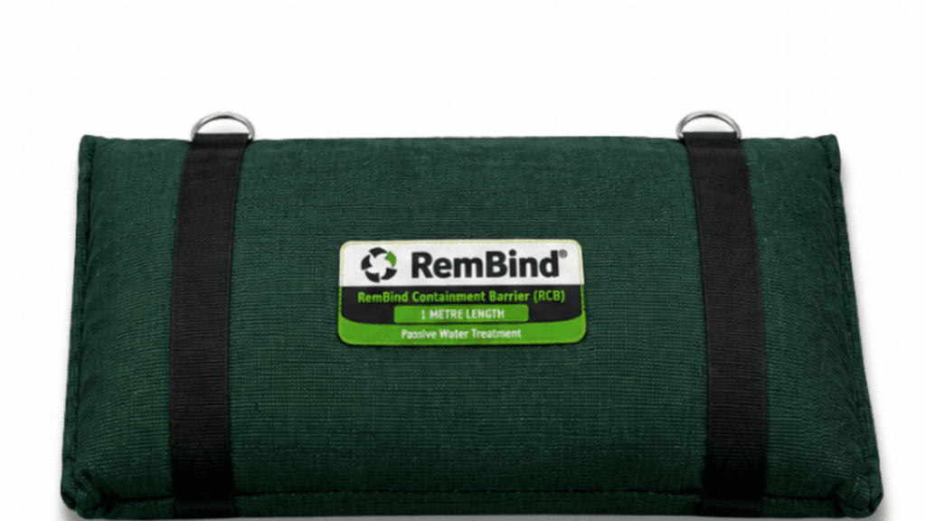 A green RemBind Containment Barrier, a fabric treatment pillow with webbing straps and lifting rings, labelled RCB one metre length.