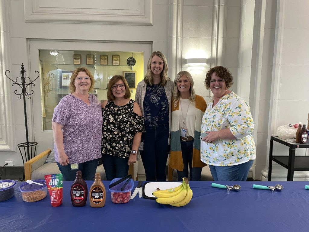 Carus employees prepare for an ice cream social